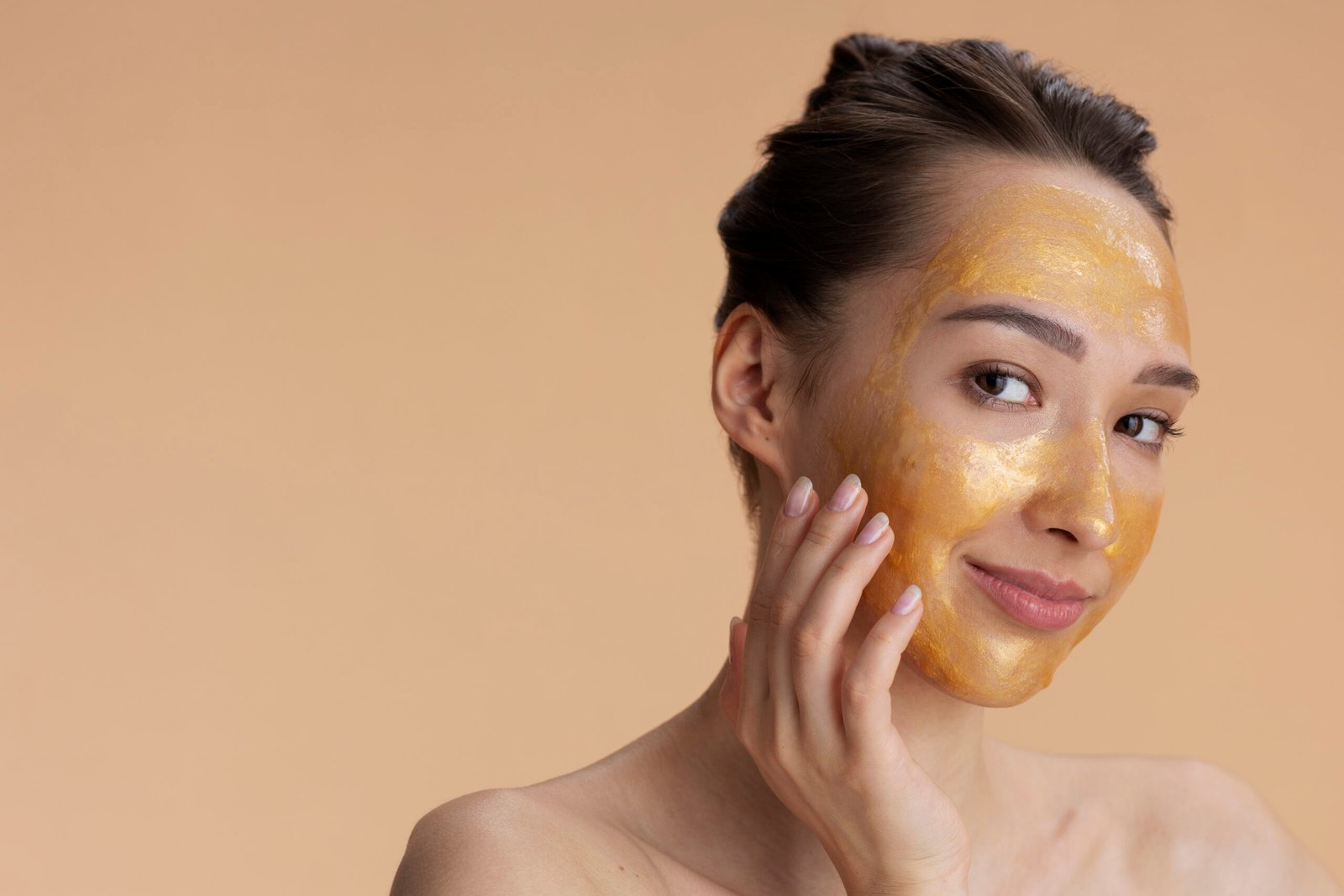 Girl applying honey face pack