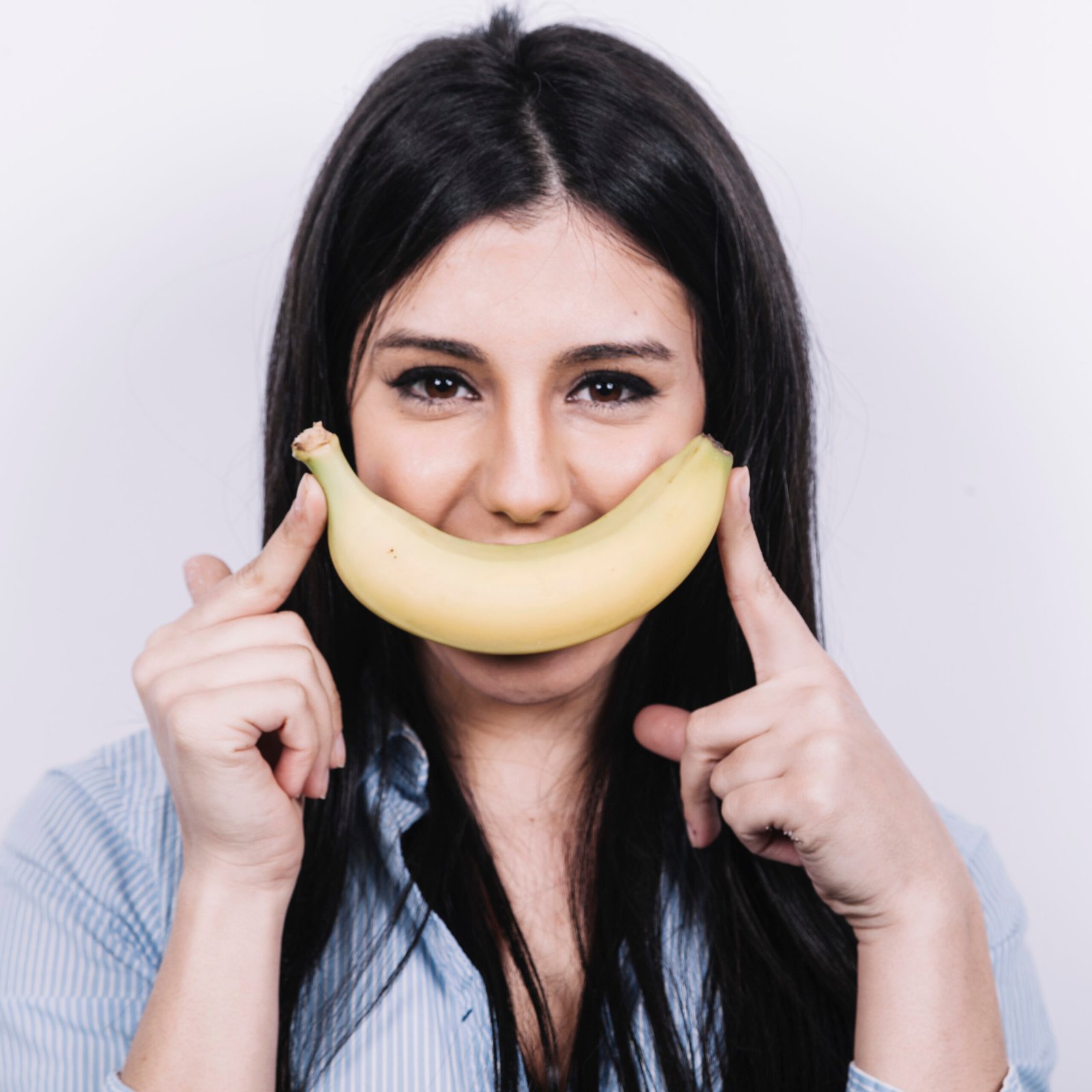 Girl holding banana